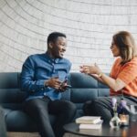 People talking to each other on a couch