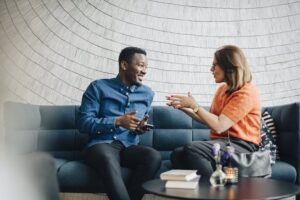 People talking to each other on a couch