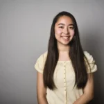 A smiling young woman who may need a dental implants