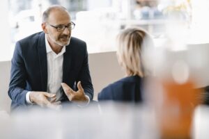 A doctor talking to a consultant to sell their practice