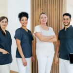 A smiling oral surgery team