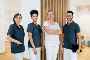 A smiling oral surgery team