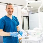 A happy looking Oral Surgery Team member fresh at work